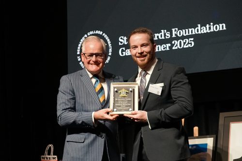 Dr Jameson Trainor (right) receives his award from Principal Dr Michael Davies